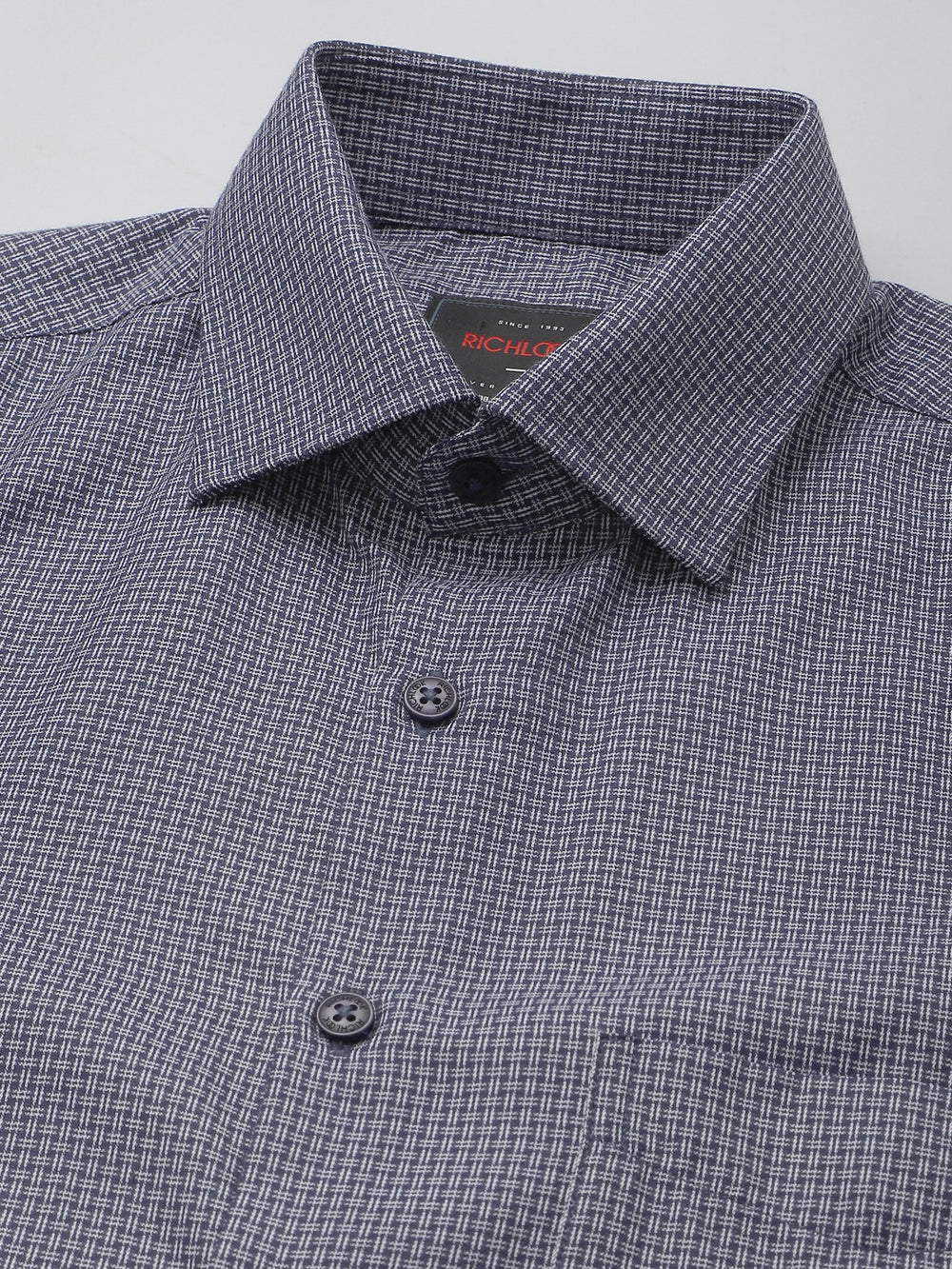 Checkered shirt with collar and buttons on a light gray background