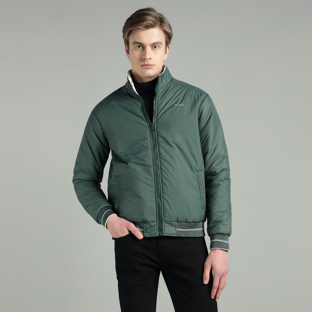 Man wearing a green jacket on a gray background